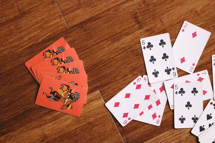 Handcrafted custom board game components on a wooden table