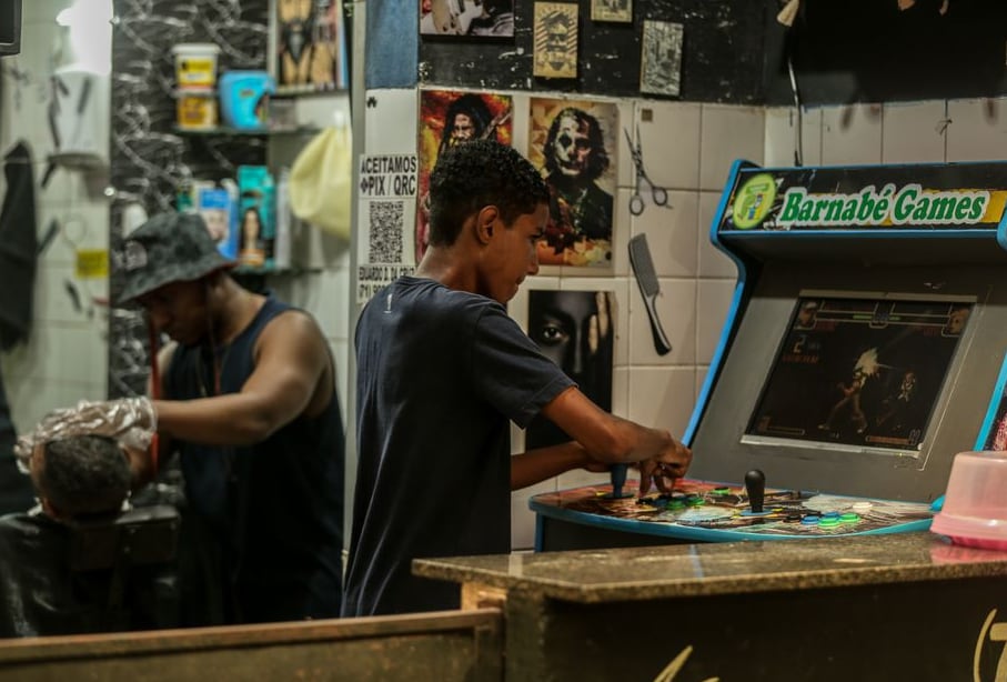 Board game designer sketching a custom game layout at a workbench
